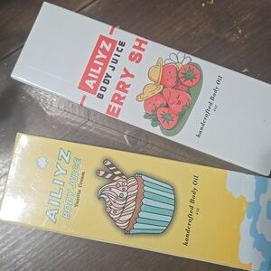 NWT TWO AILIYZ BODY OILS.. VANILLA CREAM.. STRAWBERRY SHORTCAKE.  #7771